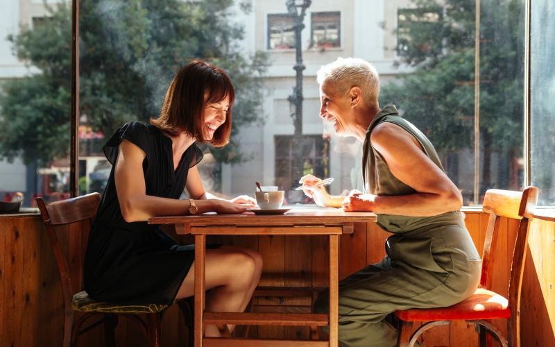 a man and woman sitting at a table